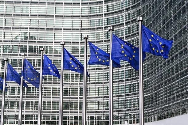 European Union flags outside the European Commission building